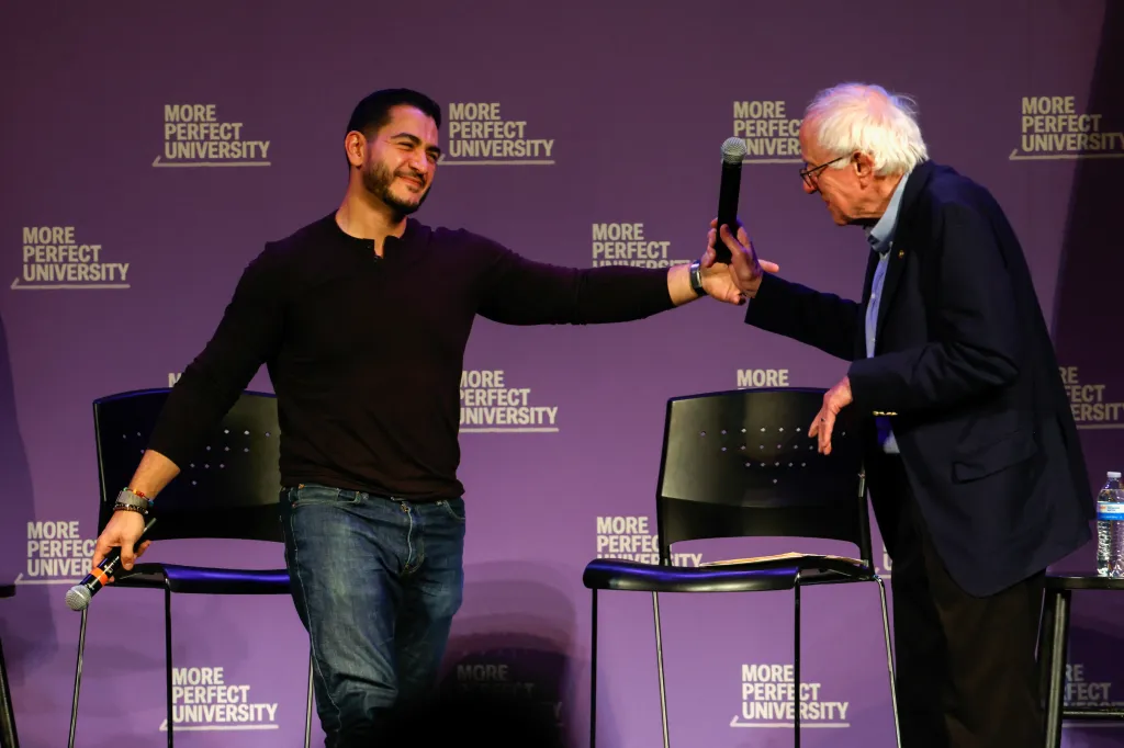 Democratic senatorial candidate for Michigan Abdul El-Sayed gestures to U.S. Sen. Bernie Sanders, I-Vt., on stage.