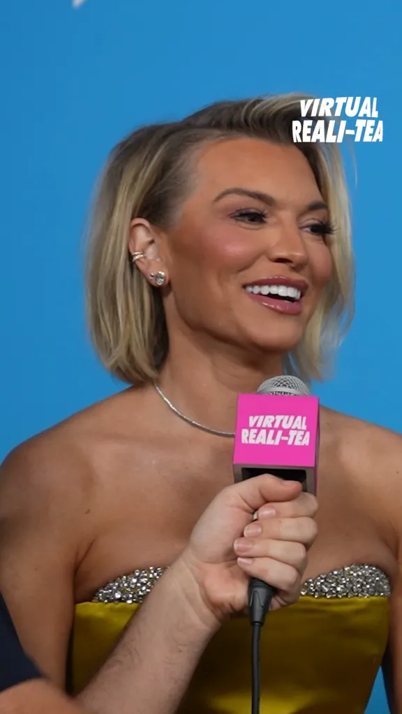 Lindsay Hubbard holding a microphone with a 