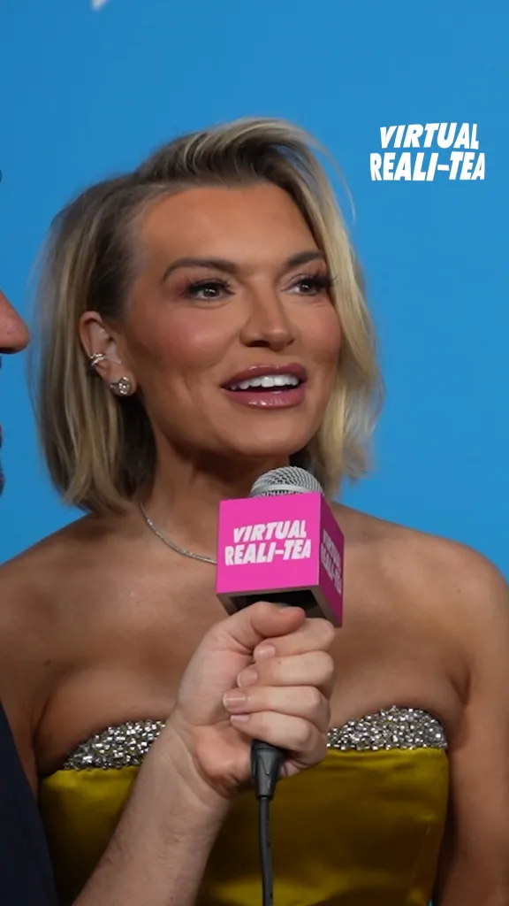 Lindsay Hubbard speaks into a pink Virtual Reali-Tea microphone.