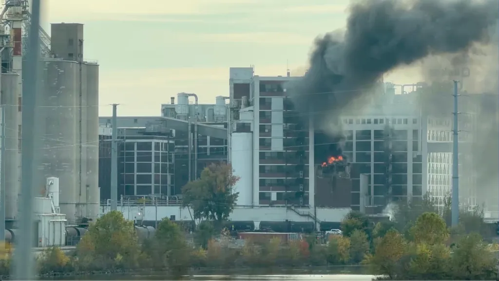 Fire and thick smoke rise from a building at the Quaker Oats facility in Cedar Rapids, Iowa.