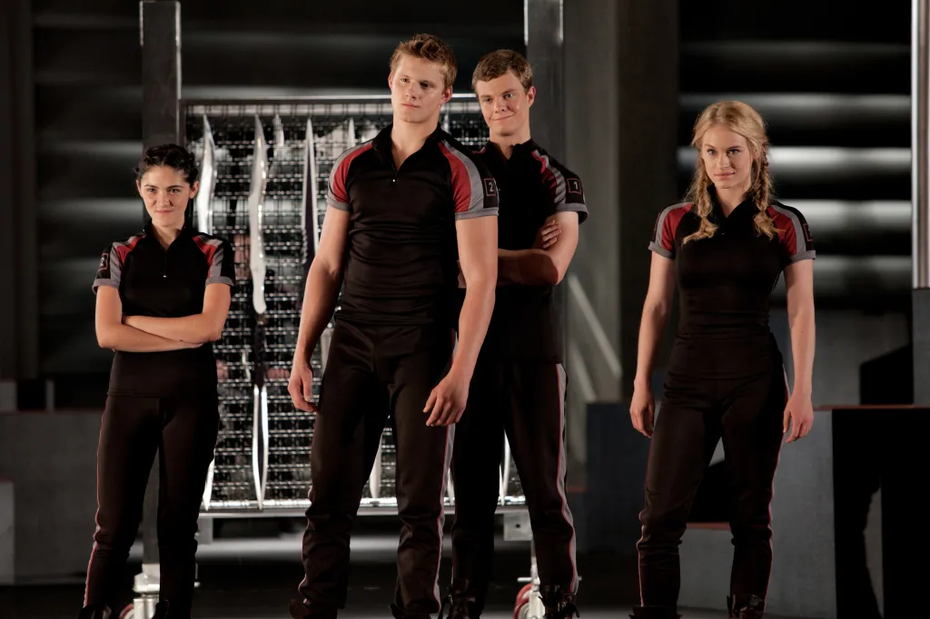 Promo photo of Isabelle Fuhrman, Alexander Ludwig, Jack Quaid, and Leven Rambin from the movie The Hunger Games.