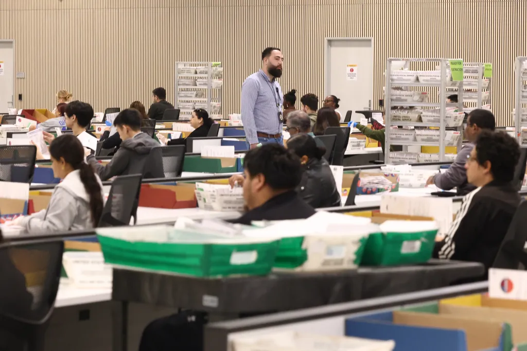 J. Robert Renner, Assistant United States Attorney, tours the election ballot processing center in City of Industry, California.
