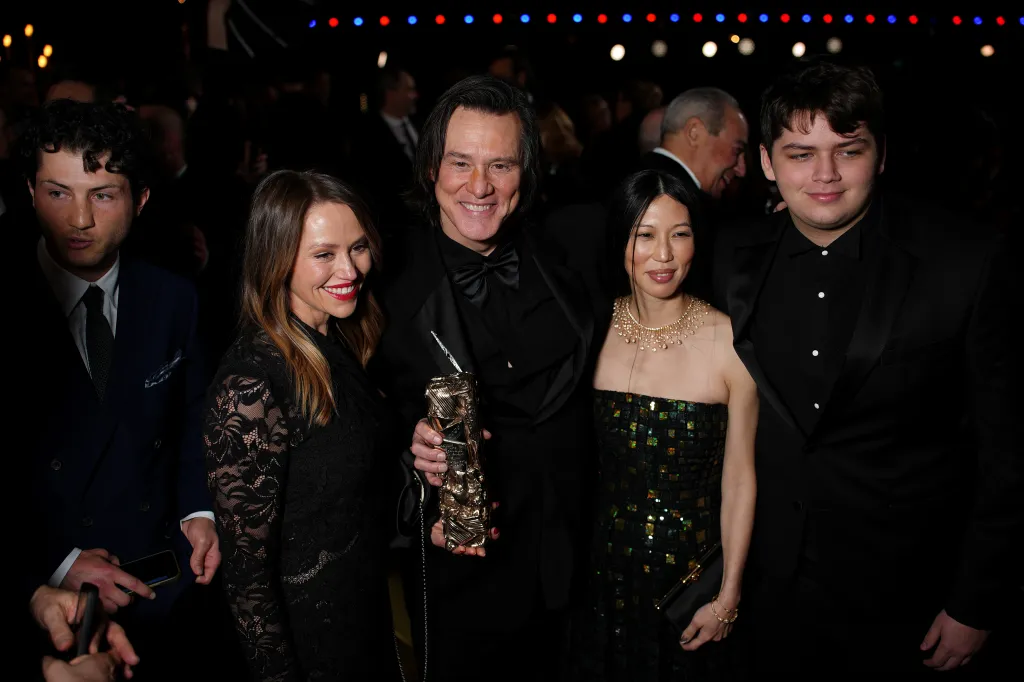Jane Erin Carrey, Jim Carrey, Min Ah and Jackson Riley pose at the 51st Cesar Film Awards in Paris.