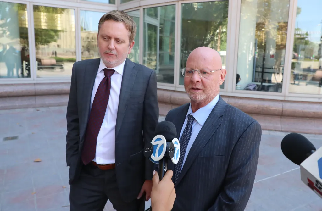 Defense lawyers Jeremy Lessem and Jeffrey Rubenstein speaking to reporters outside the Van Nuys Courthouse.