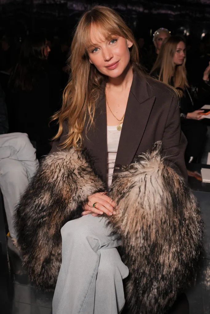 Jennifer Lawrence sitting in the front row at the Dior fashion show.