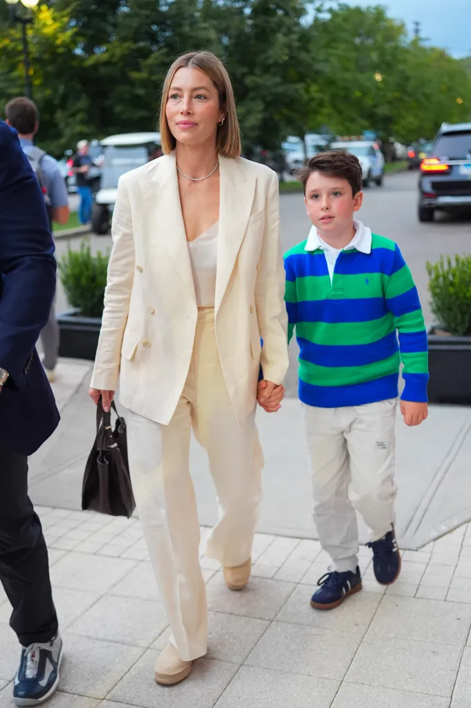 Jessica Biel and her son Silas Timberlake walk hand-in-hand.