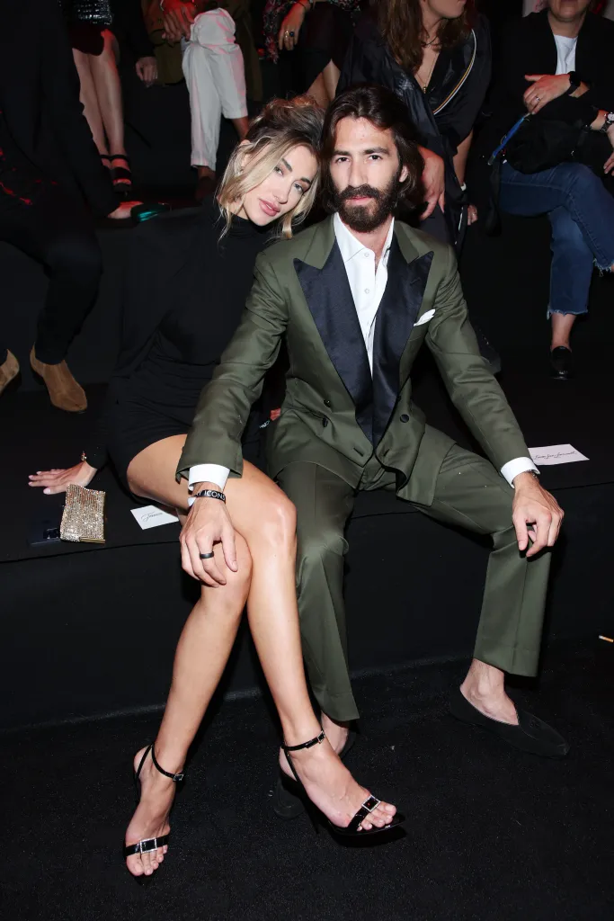 Jessica Serfaty and Leonardo Maria del Vecchio pose together at a fashion event.