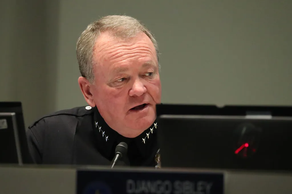 Jim McDonnell, chief of police for the Los Angeles Police Department, listens at a Police Commission meeting in the hearing room of the LAPD.