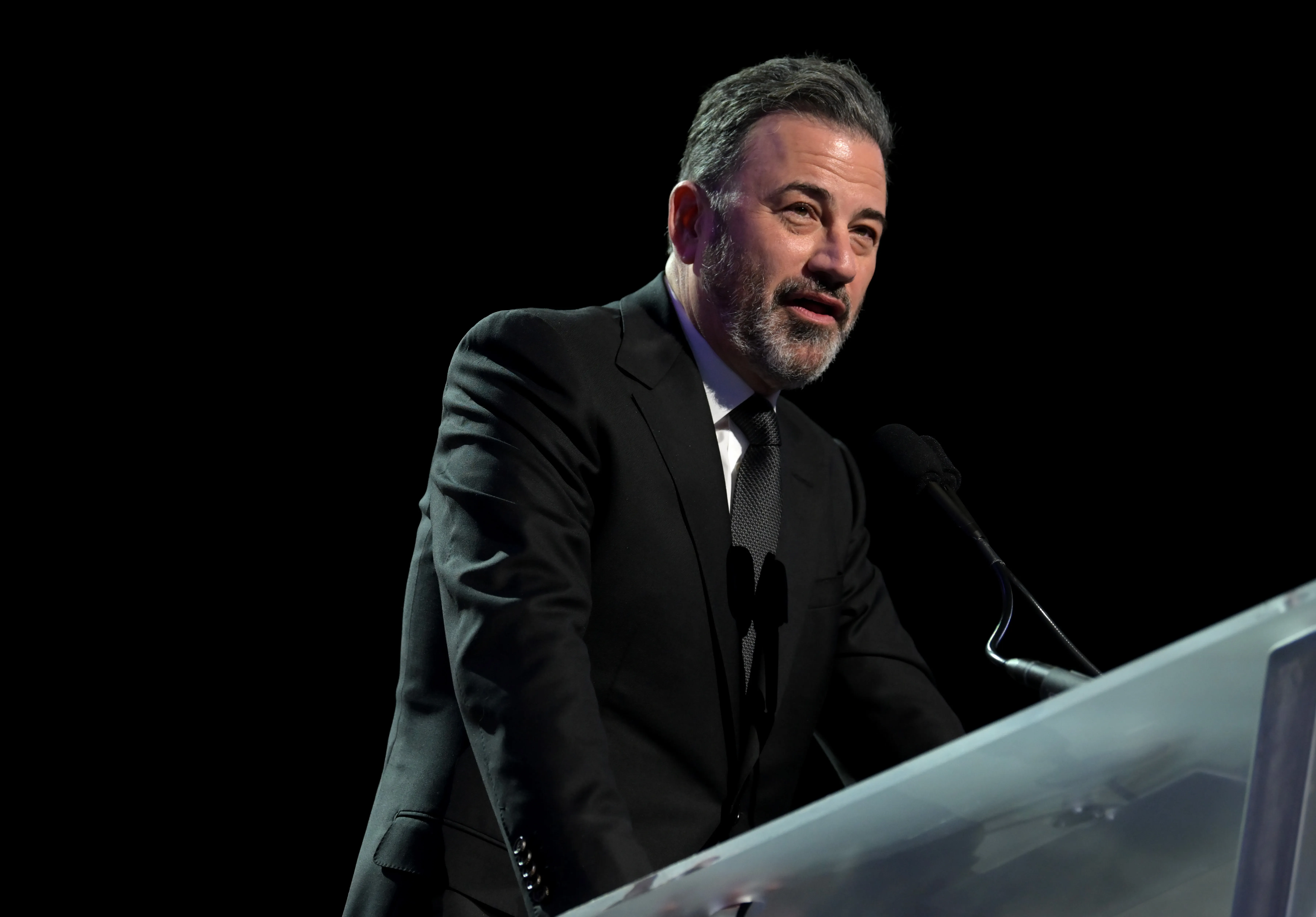 Jimmy Kimmel speaks at a podium during the 