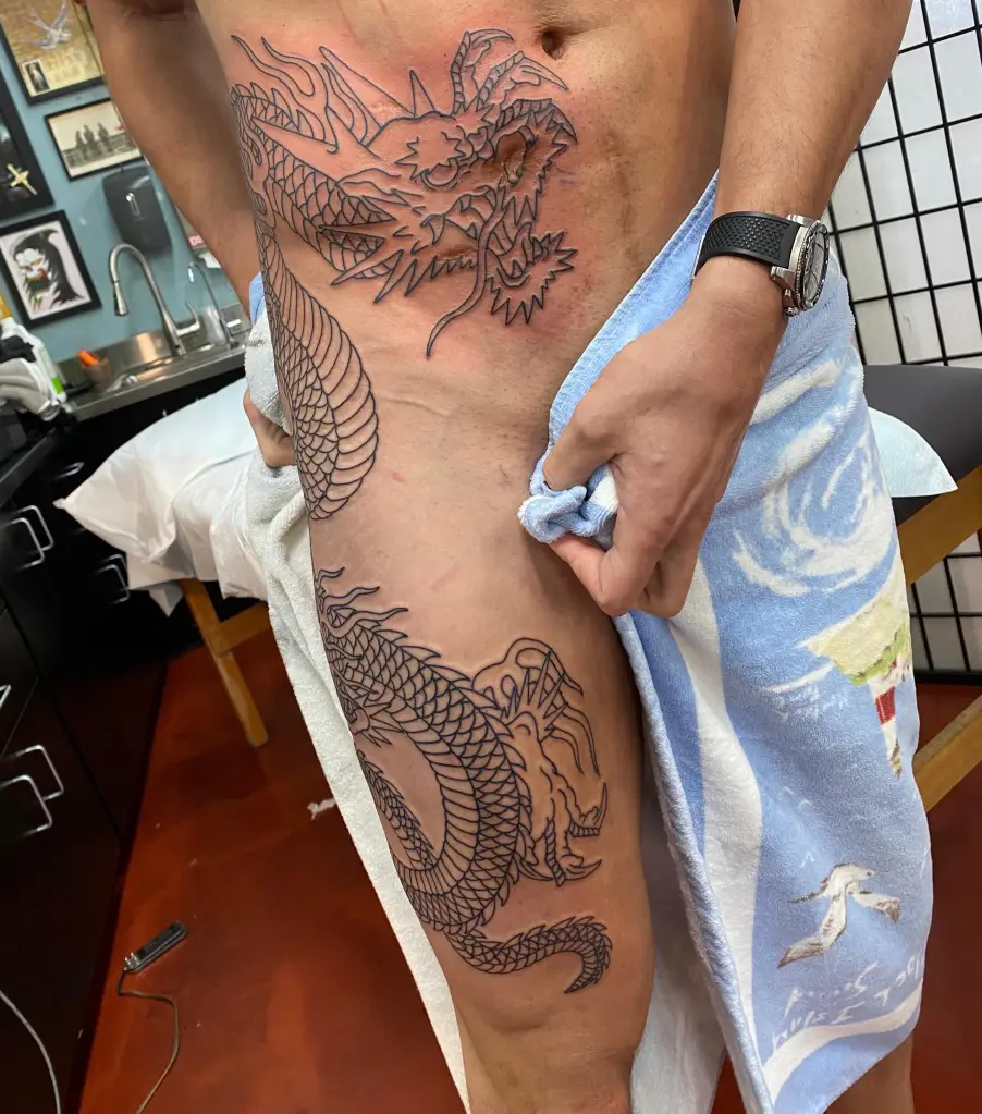 Joe Manganiello's massive dragon tattoo covering his surgery scars.