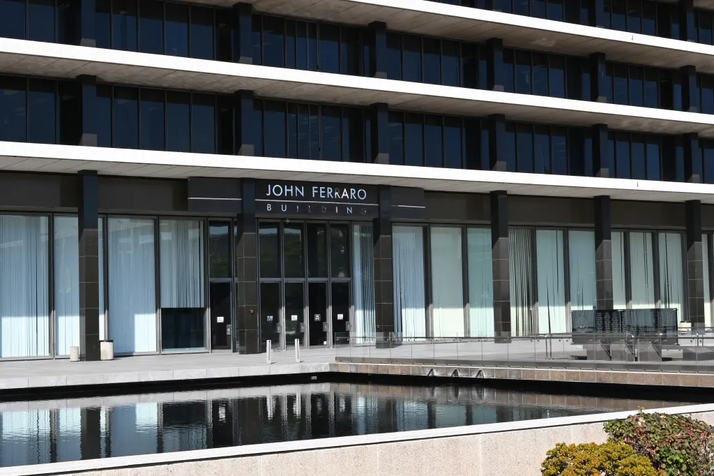 Exterior view of the John Ferraro Building, headquarters of the Los Angeles Department of Water and Power, featuring its reflecting pool and entrance.