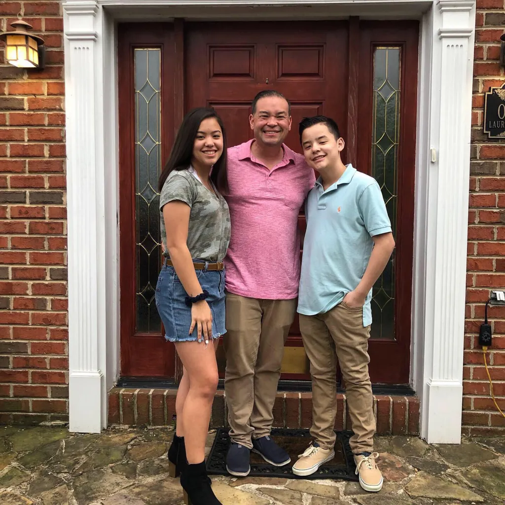 Jon Gosselin stands outside with his children Hannah and Collin.
