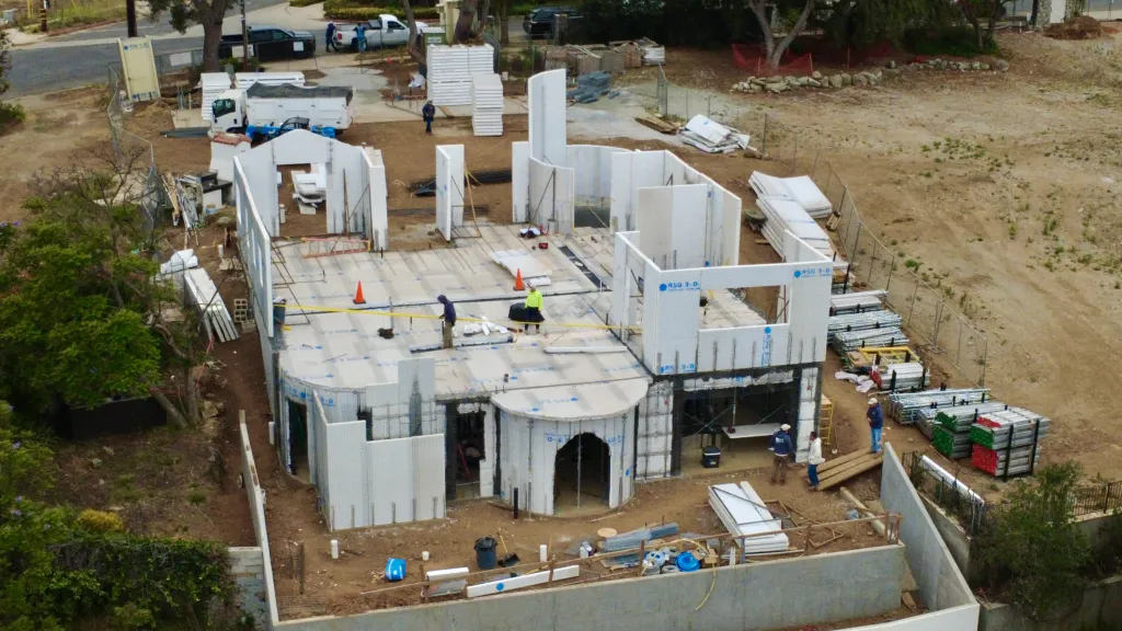 An aerial view of the home of Caleb and Mary Jo Deschanel under construction after being destroyed by the Palisades fire.