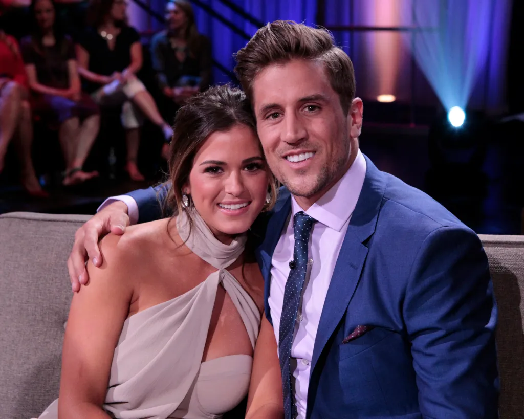 JoJo Fletcher and Jordan Rodgers sitting together smiling on the set of The Bachelorette.