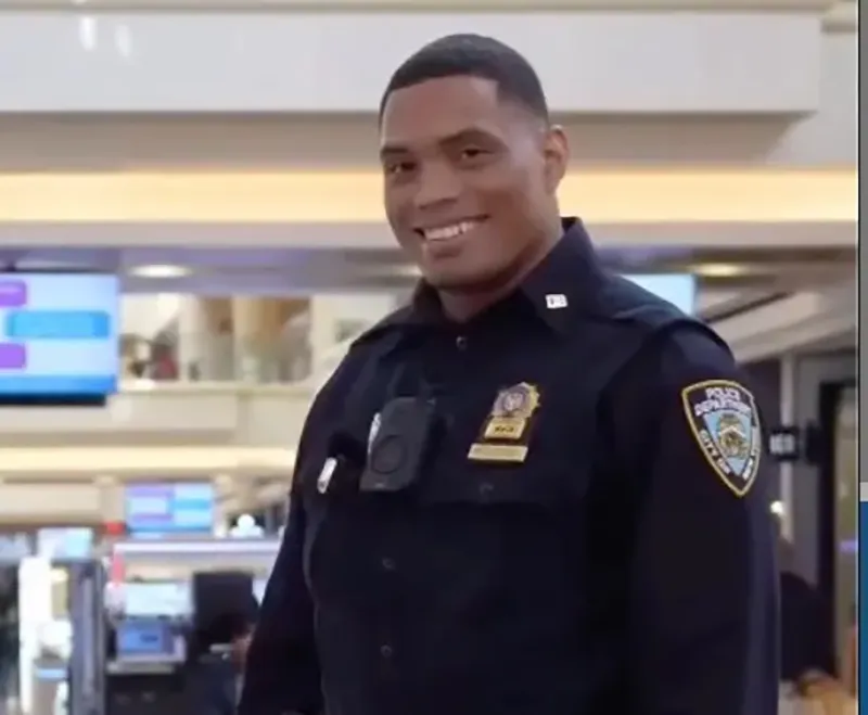 Detective Jose Mercedes smiling in NYPD uniform.