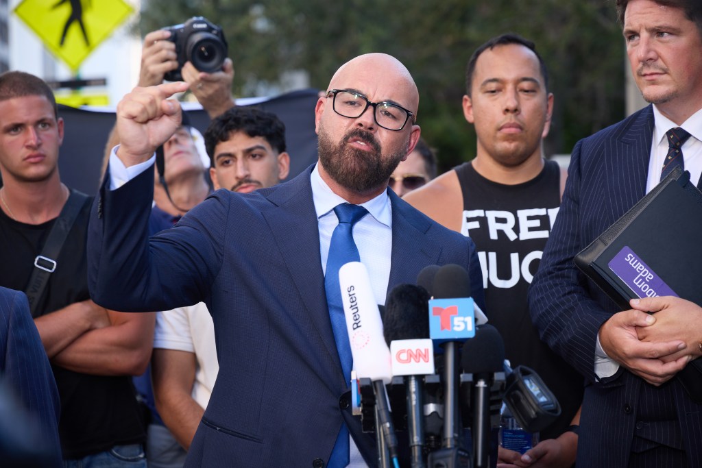 Joseph McBride, lead counsel for Andrew and Tristan Tate, speaks with reporters outside of a courthouse.
