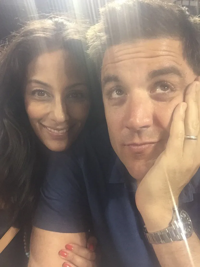 Liz Cho and Josh Elliott posing for a selfie.