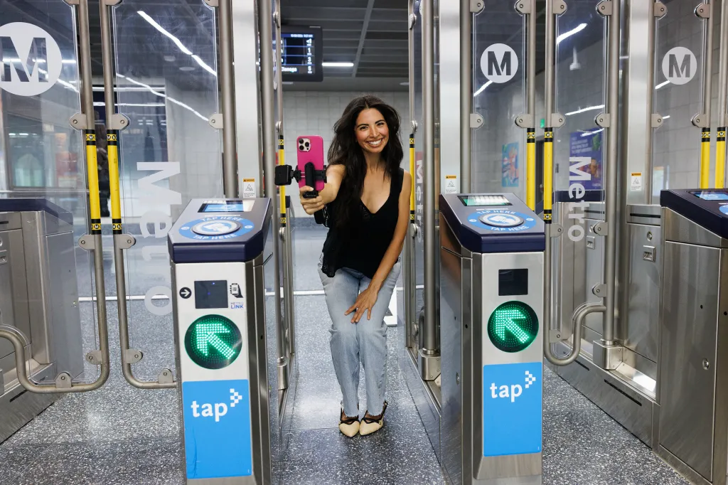 Juiana takes a selfie at the Wilshire Blvd and Fairfax Ave station in Los Angeles, California.