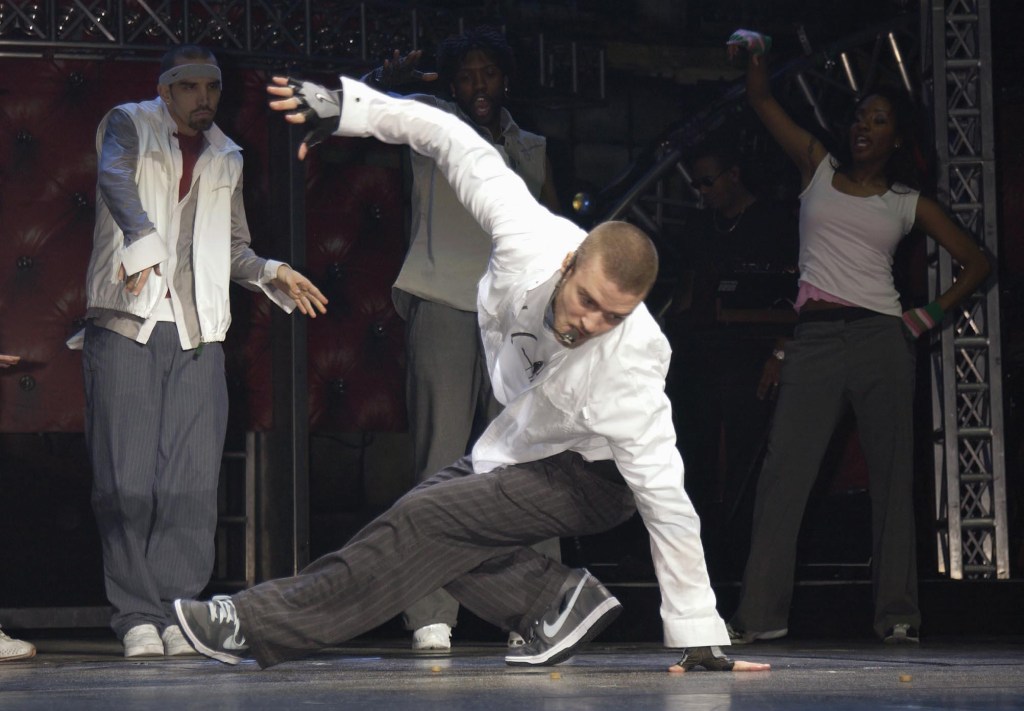 Justin Timberlake performs on stage with backup dancers at Earl's Court in London.