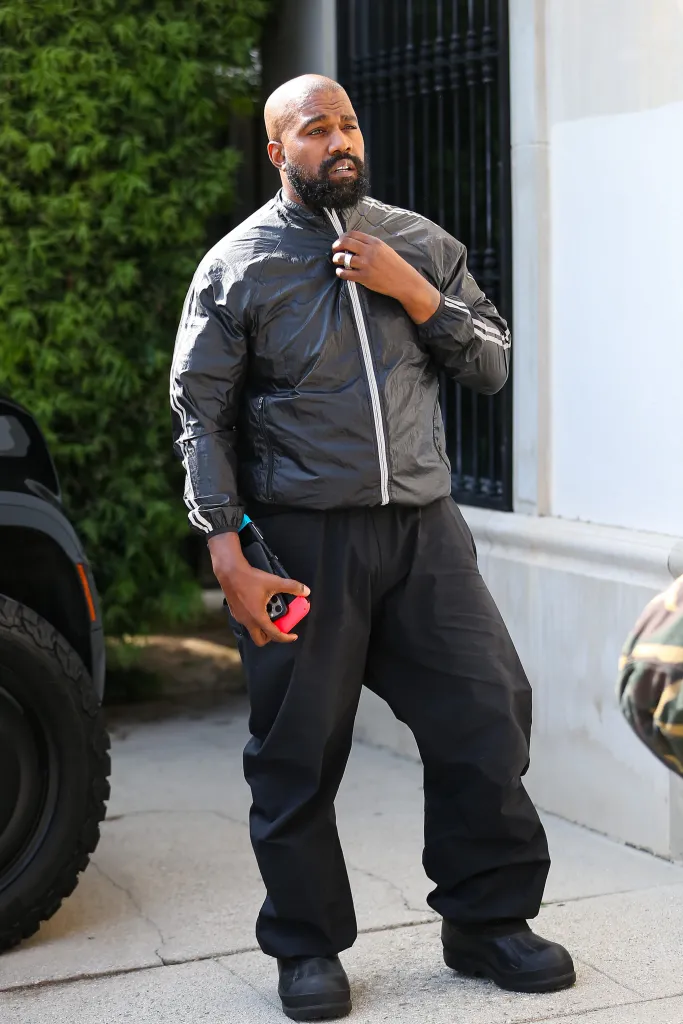 Kanye West is seen wearing a black jacket and pants in Los Angeles.