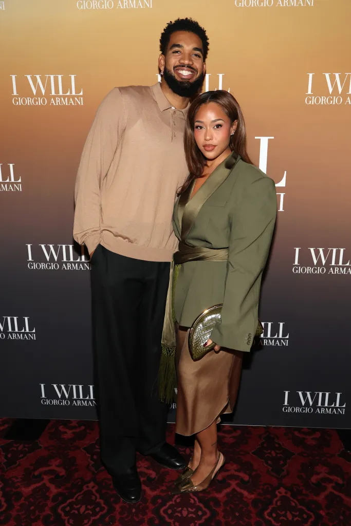 Karl-Anthony Towns and Jordyn Woods posing together at an Armani Beauty event.