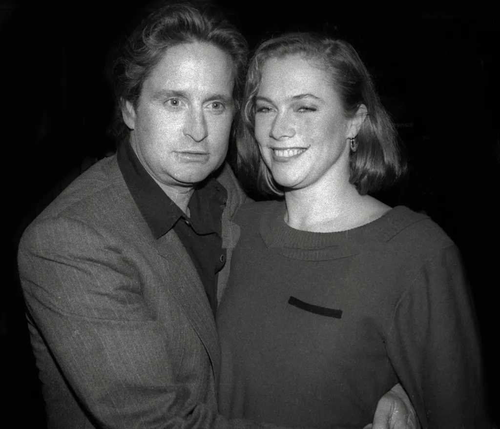 Black and white photograph of actors Michael Douglas and Kathleen Turner in New York City.