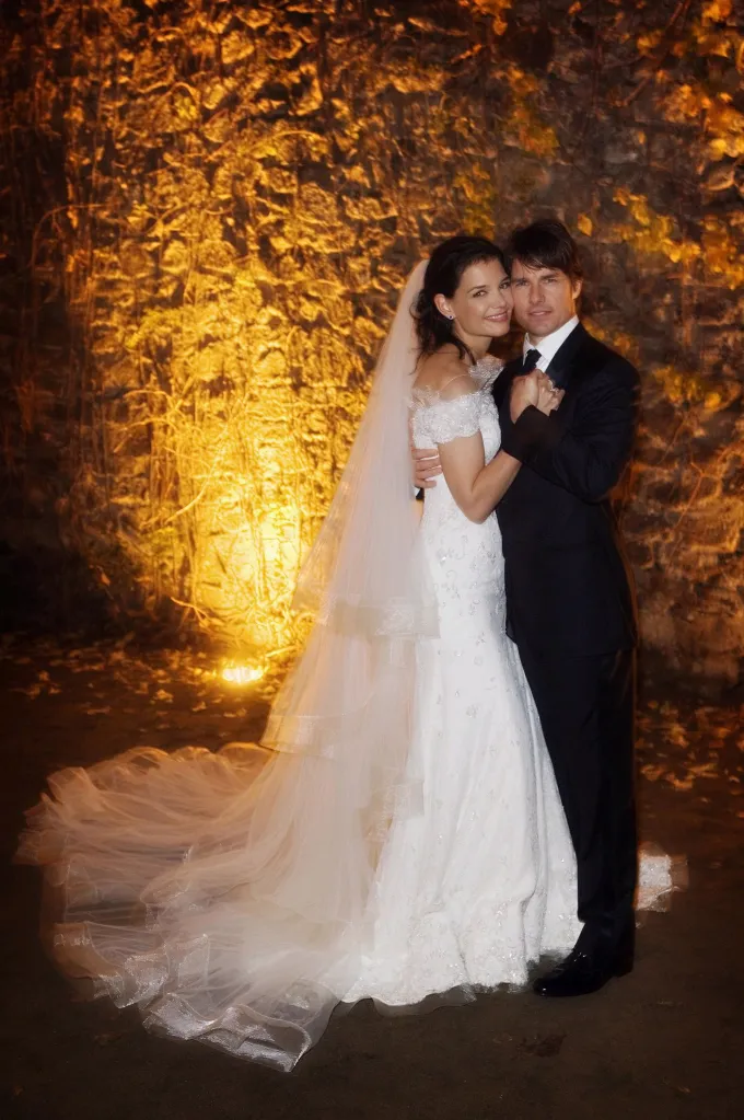 Tom Cruise and Katie Holmes holding hands at their wedding in Italy.