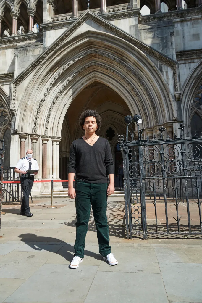 Keira Bell stands outside the Royal Courts of Justice in London.