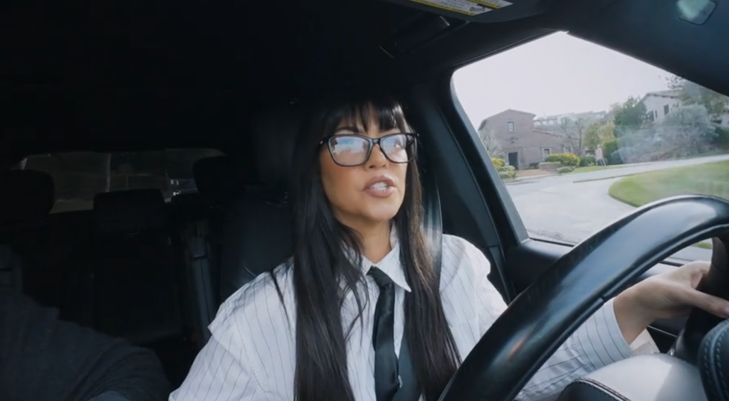 Kourtney Kardashian driving a car.