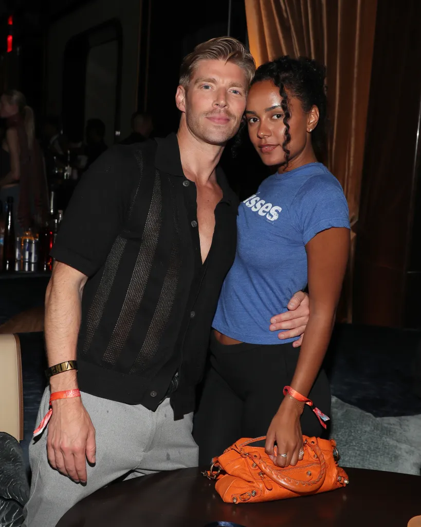 Kyle Cooke and Ava Dash pose together at an event.