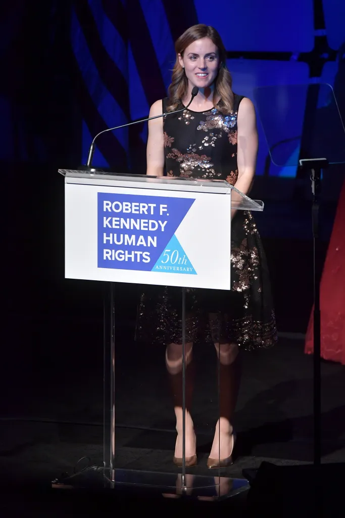 Kyle Kennedy Kerr speaks at a podium during the Robert F. Kennedy Human Rights Ripple Of Hope Awards.