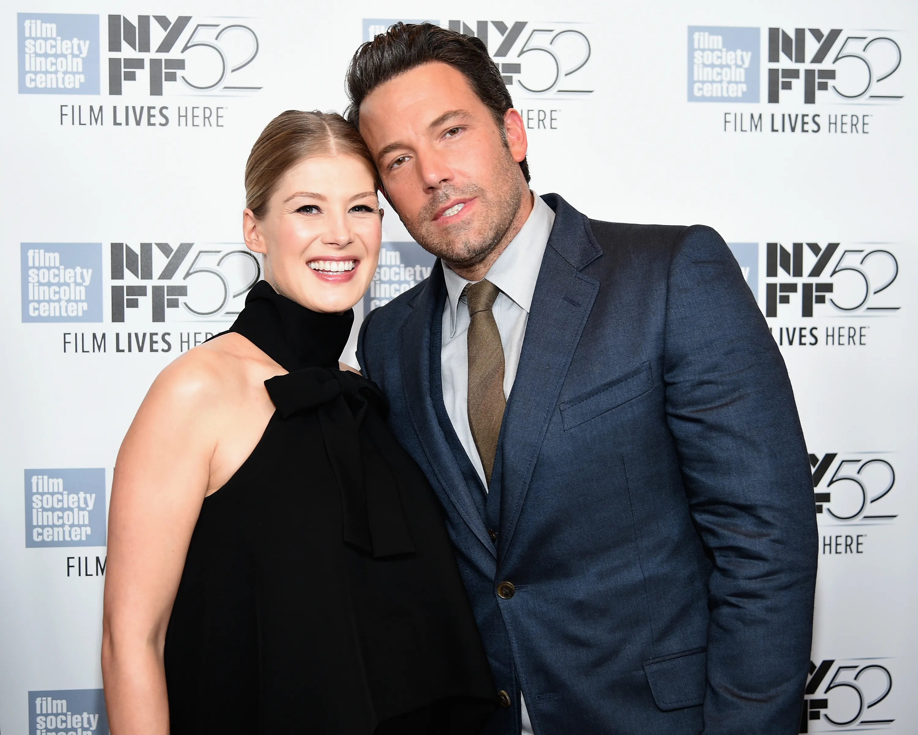 Actors Rosamund Pike and Ben Affleck pose together at the world premiere of