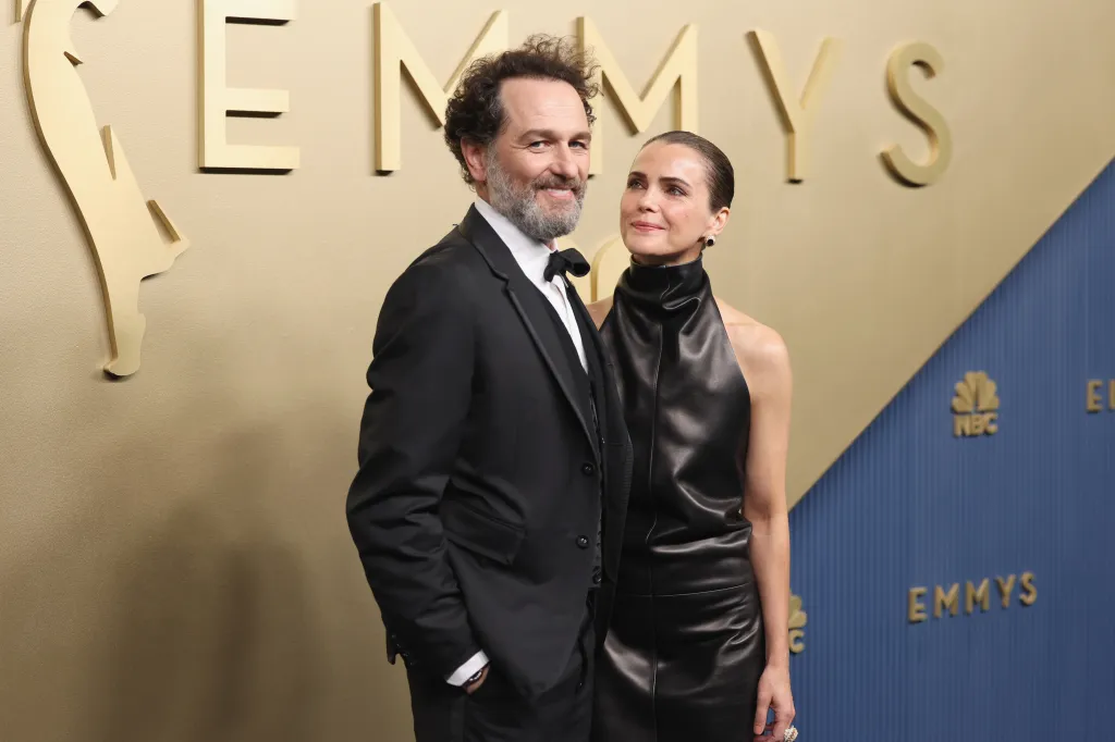 Matthew Rhys and Keri Russell pose together on the red carpet at the Emmy Awards.