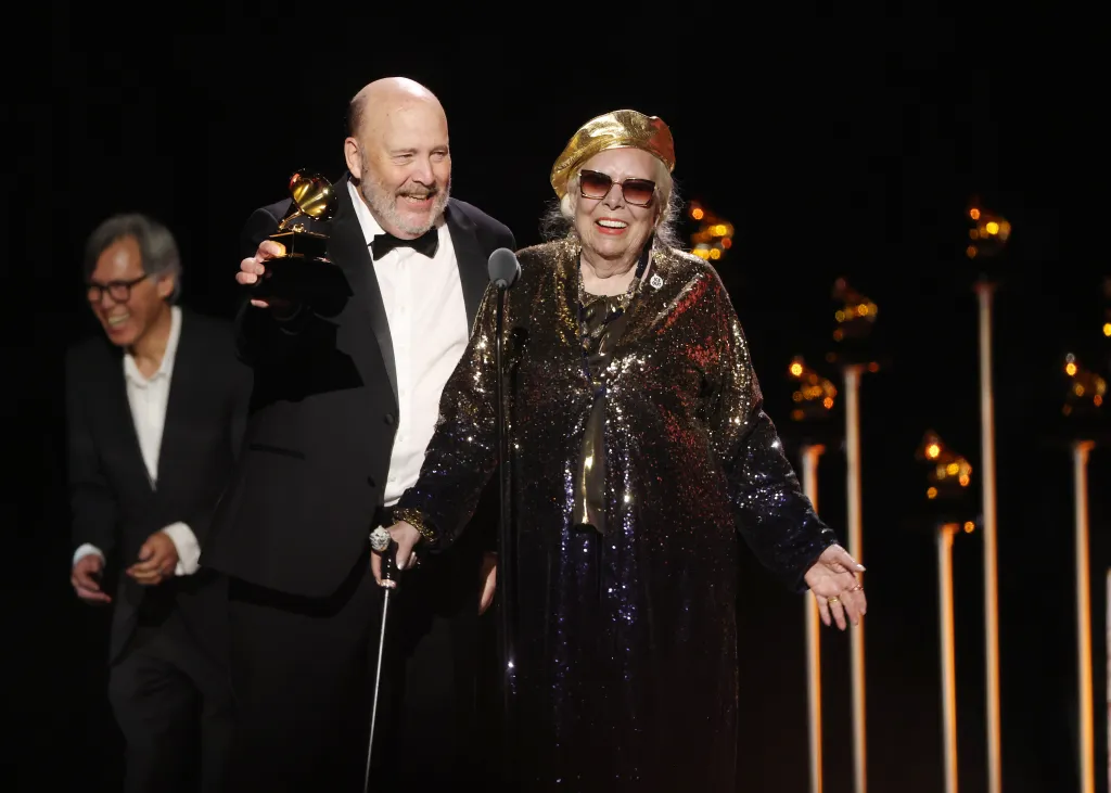 Patrick Milligan and Joni Mitchell accept the Best Historical Album award at the GRAMMY Awards.