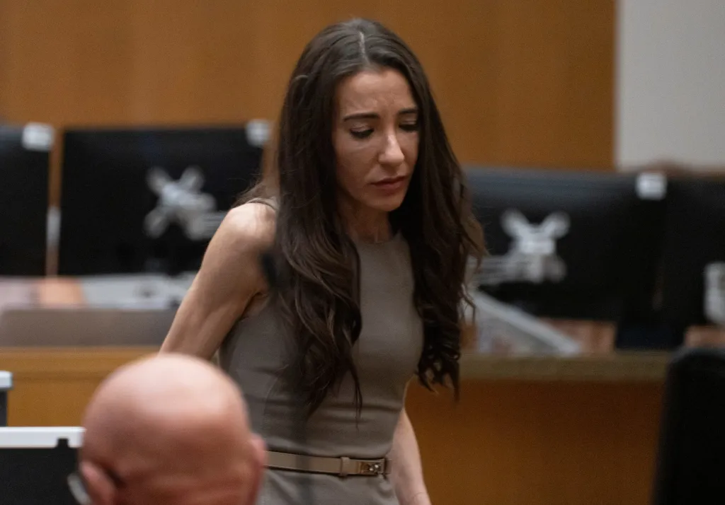 Laura Owens stands in a courtroom in Maricopa County Superior Court.