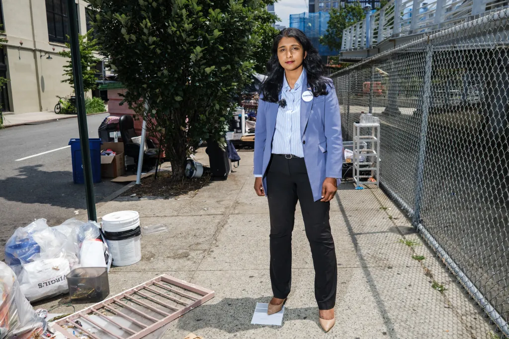 Lawyer Saritha Komatireddy visits a homeless encampment site on a New York sidewalk.
