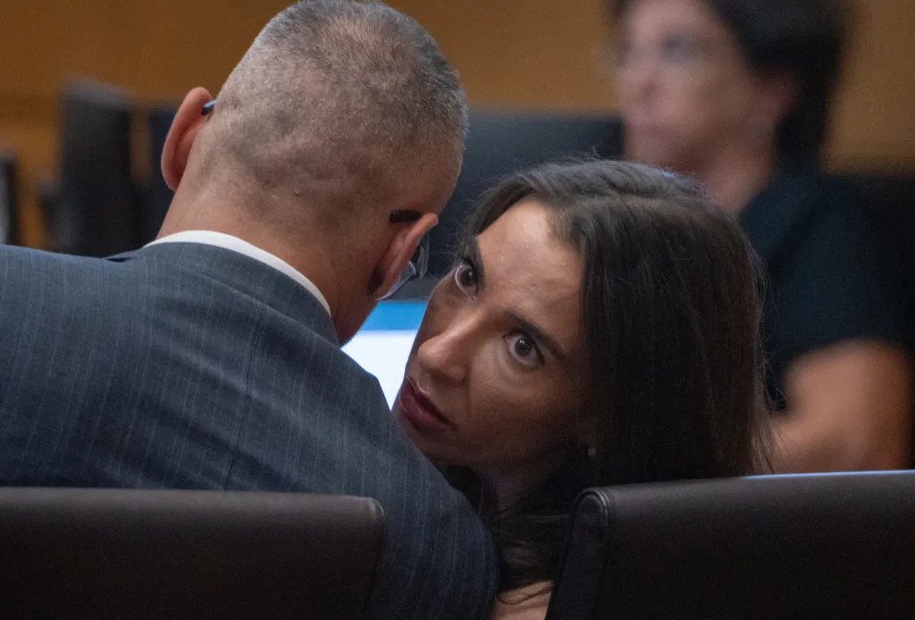 Laura Owens talks with her attorney, Christian Lueders, during her sentencing hearing in Maricopa County Superior Court.