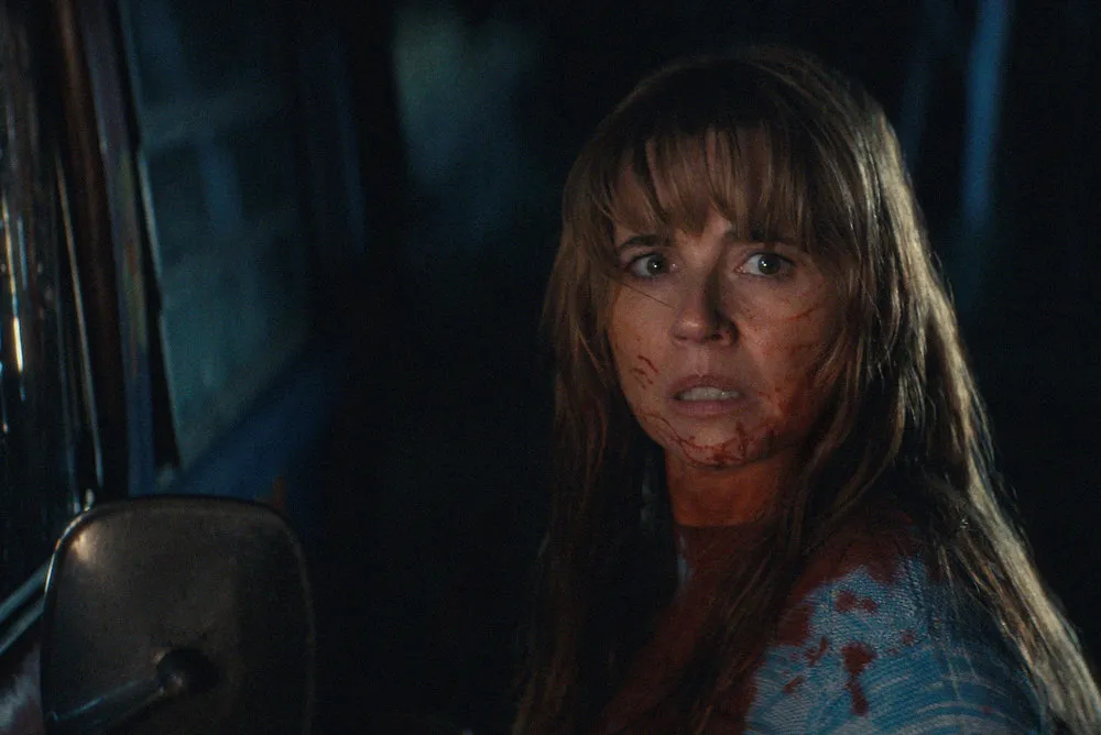 Linda Cardellini as Pam covered in blood in 