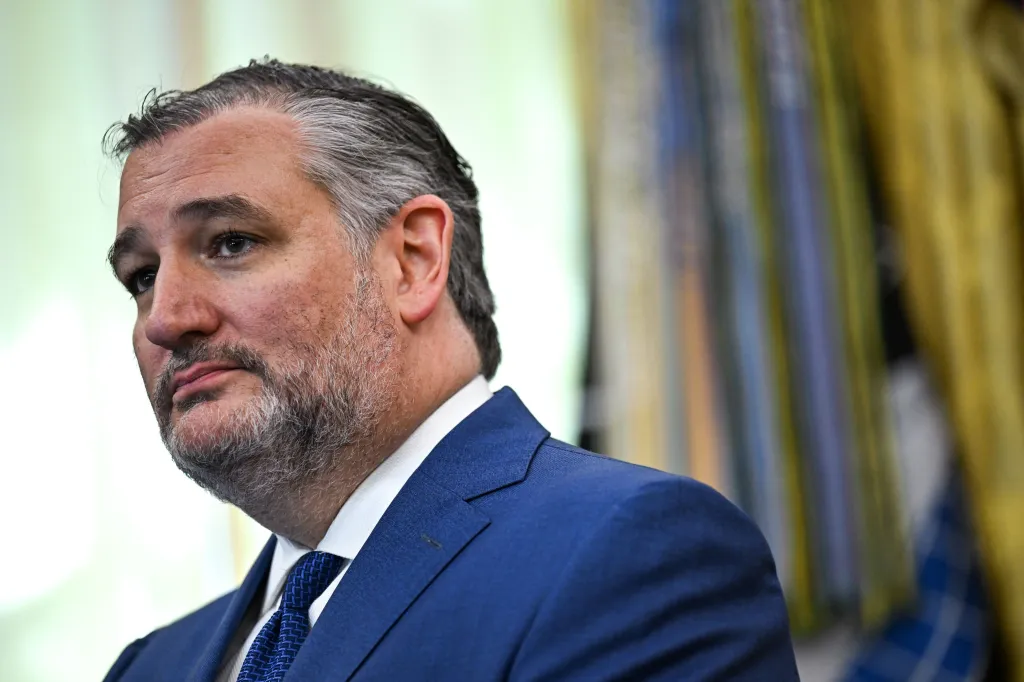 Sen. Ted Cruz listens during an announcement in the Oval Office.