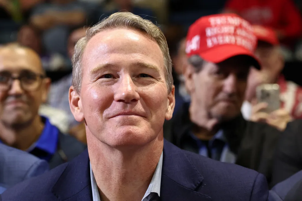 US Senator Jon Husted listens to US President Donald Trump speak during a campaign rally in Youngstown, Ohio.