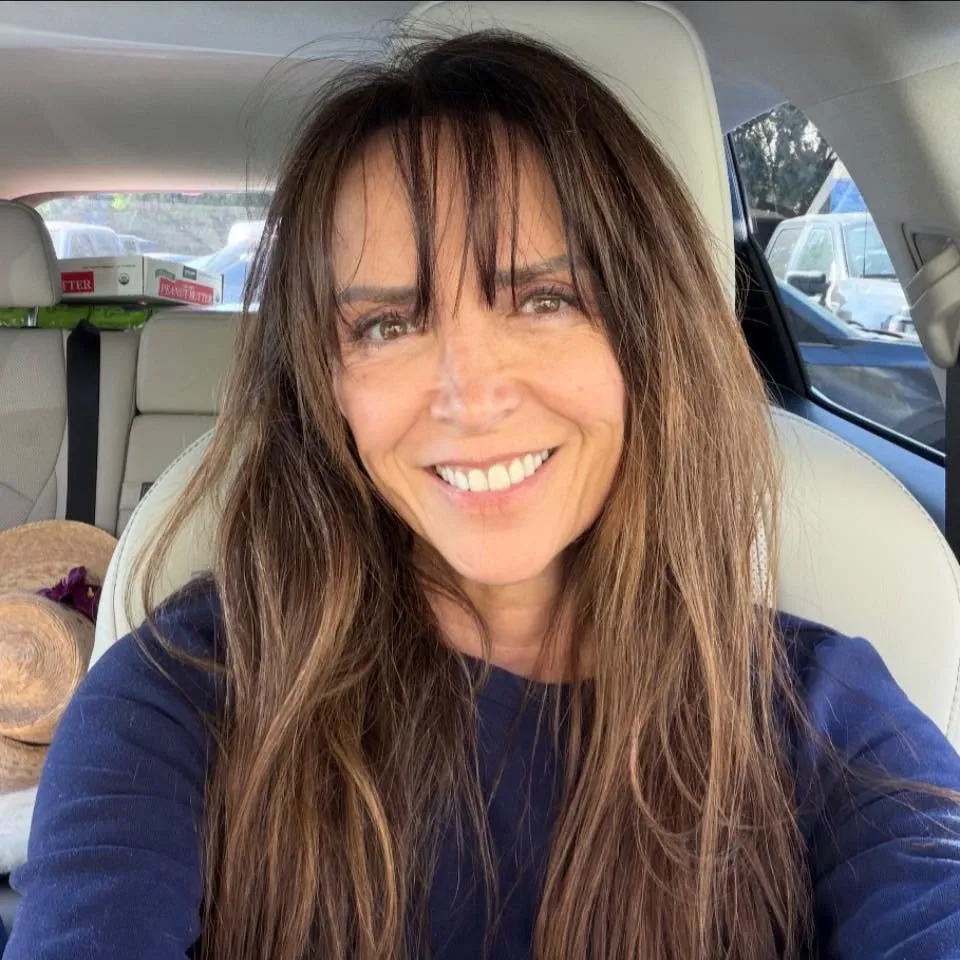 Liz Angeles sitting inside a car.