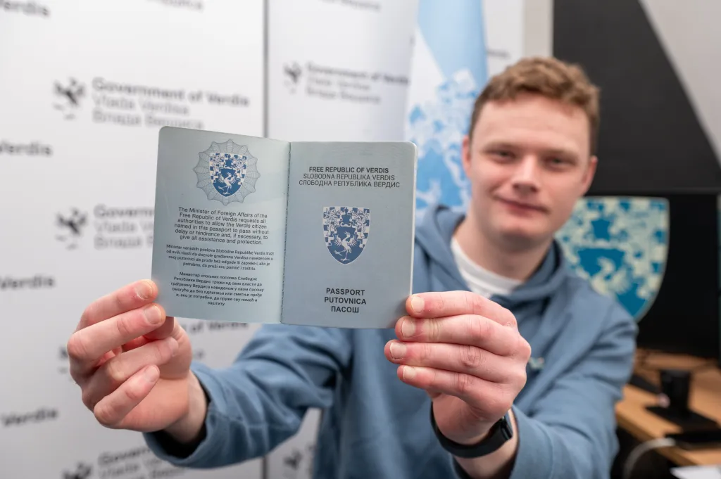 Daniel Jackson, shows off a passport of the Free Republic of Verdis.