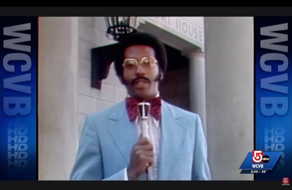 WCVB-TV news reporter Jim Boyd holding a microphone.