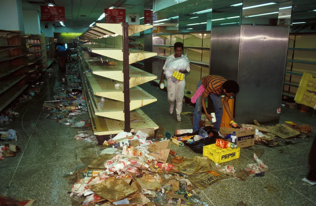 Looters in a supermarket during riots.
