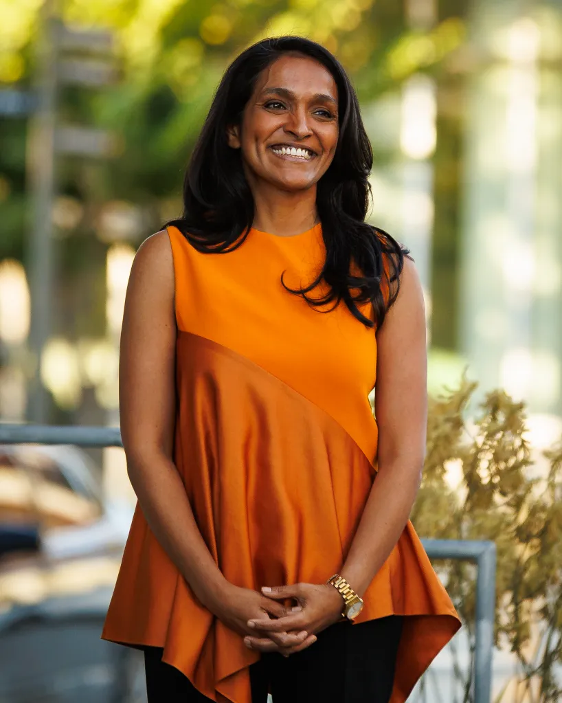 Los Angeles mayoral candidate Nithya Raman smiles while waiting to go on stage.