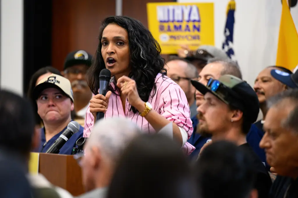 Los Angeles mayoral candidate Nithya Raman speaks into a microphone during a campaign event.
