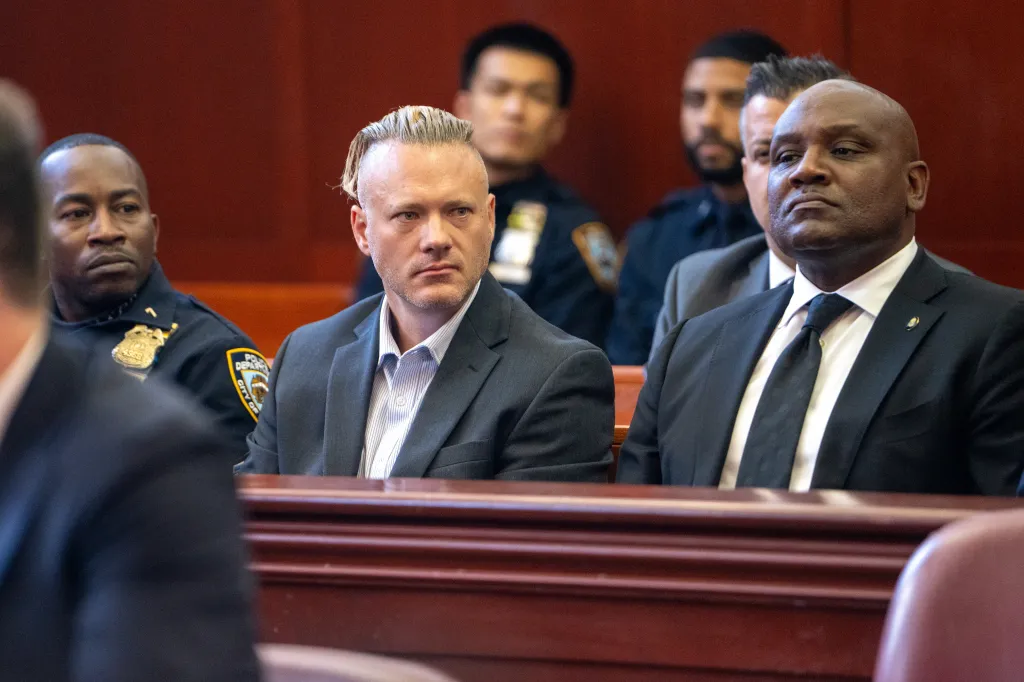 Lt. Carl Johnson and other individuals in a courtroom.