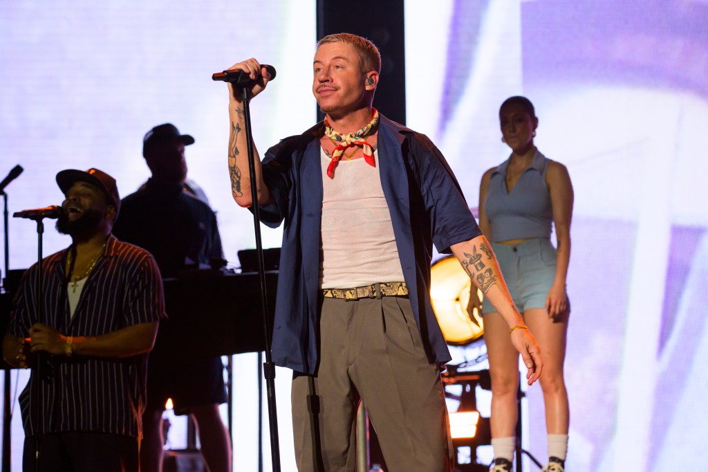 Macklemore performs onstage at Accor Arena in Paris.