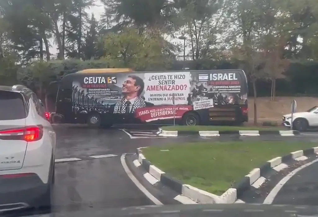 A bus in Madrid wrapped in a campaign comparing the Ceuta border breach to the October 7 attacks.