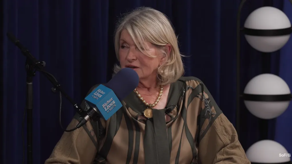 Martha Stewart speaking into a microphone during an interview.